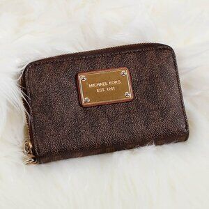Michael Kors MK Signature Logo Zip Around Continental Wallet in Brown.